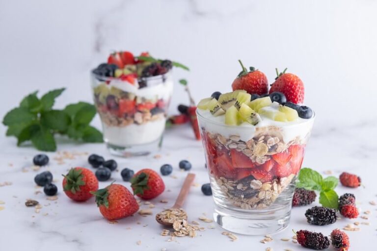 homemade-muesli-bowl-oat-granola-with-yogurt-fresh-blueberries-mulberry-strawberries-kiwi-mint-nuts-board-healthy-breakfast-copy-space-healthy-breakfast-concept-clean-eating-1